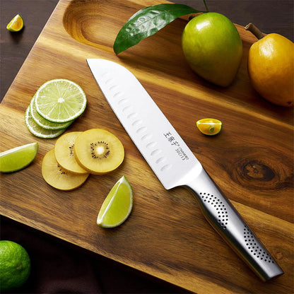 This Santoku knife features an elegant design with smooth lines. The combination of the hollow blade and the smooth body effectively prevents food from sticking, ensuring a seamless cutting experience. Whether you're slicing vegetables or meat, the kitchen knife handles the task with ease.
