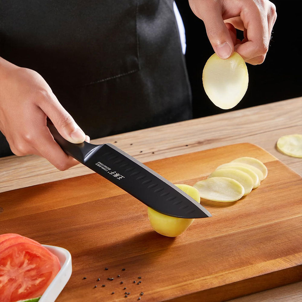 This sleek, black chef knife combines style and performance with a premium German stainless steel blade for exceptional sharpness and durability. Its ergonomic handle offers a comfortable, secure grip, while the black finish adds a modern, professional look to any kitchen.